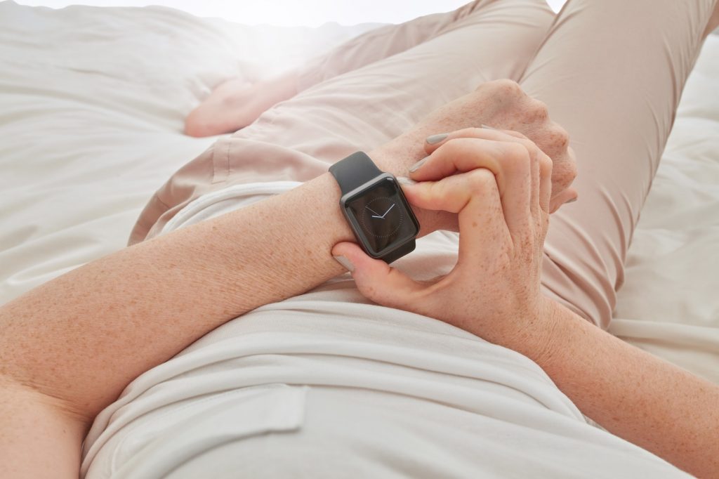 Woman using smartwatch to check time